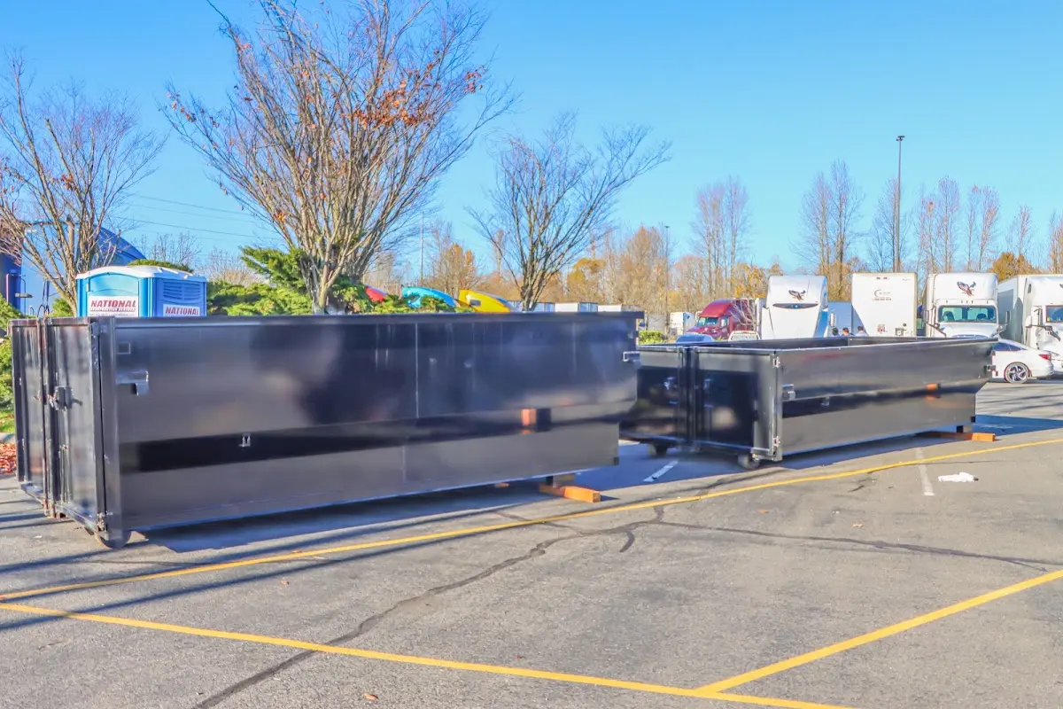 Professional dumpster rental service with roll-off container on residential driveway in Montecito